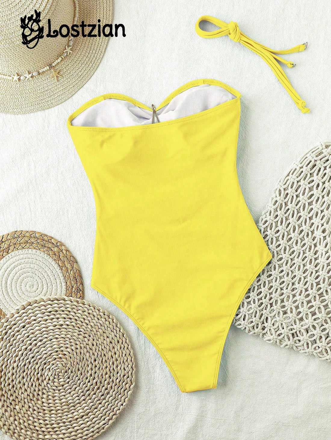 Yellow swimsuit with a straw hat and mats on a white background, featuring the brand 'Lostzian'.