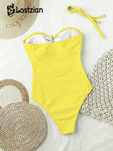 Yellow swimsuit with a straw hat and mats on a white background, featuring the brand 'Lostzian'.