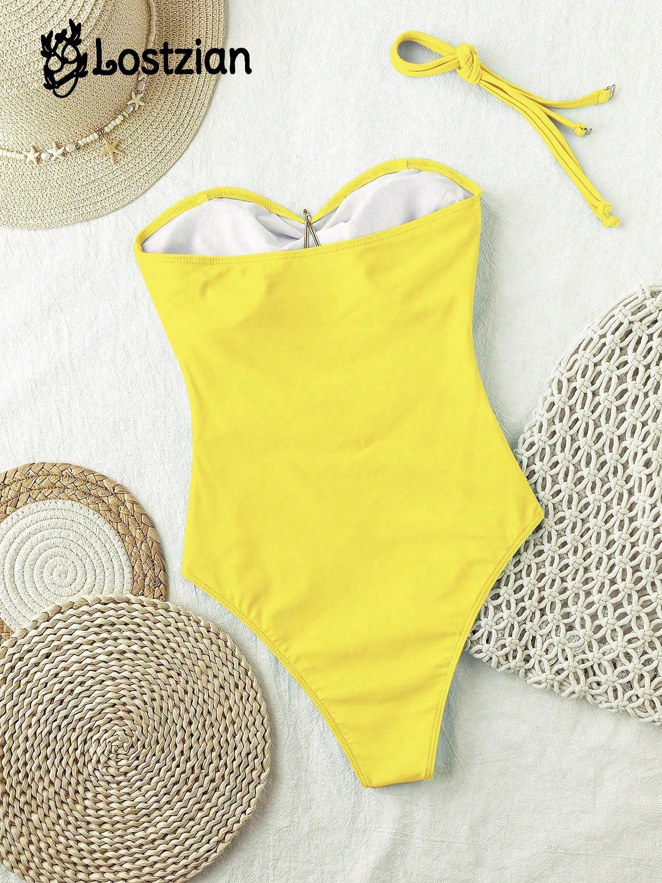 Yellow swimsuit with a straw hat and mats on a white background, featuring the brand 'Lostzian'.