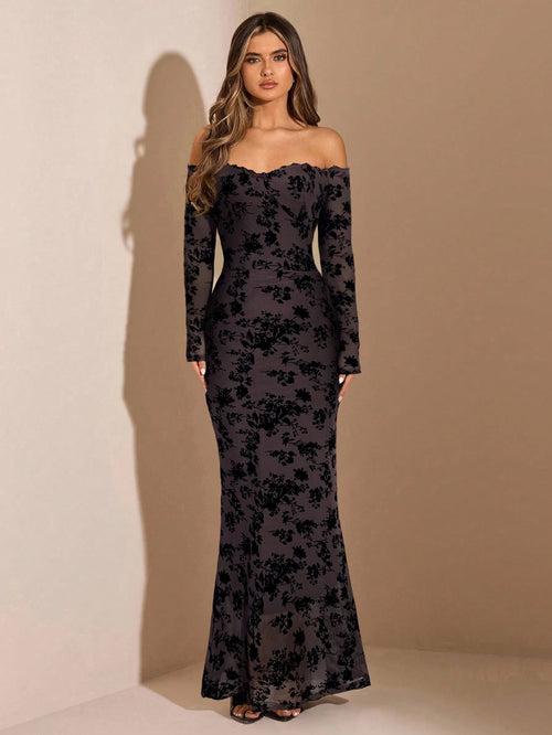 Woman wearing a black floral off-shoulder gown against a beige background