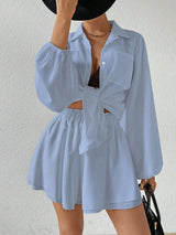 Light blue outfit with a matching top and shorts on a plain background