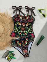 Colorful floral swimsuit with decorative elements on a textured surface.