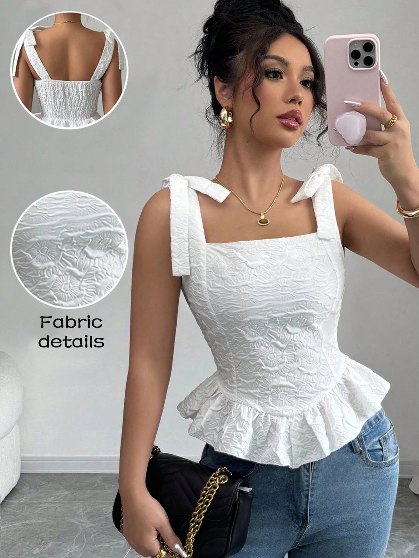 Woman wearing a white top with ruffled details, taking a selfie in a room.