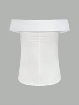 White off-shoulder top on a gray background