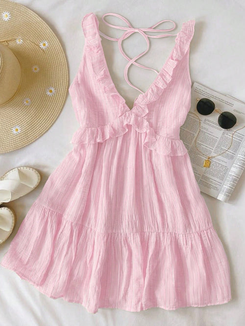 Pink dress with thin straps on a white background