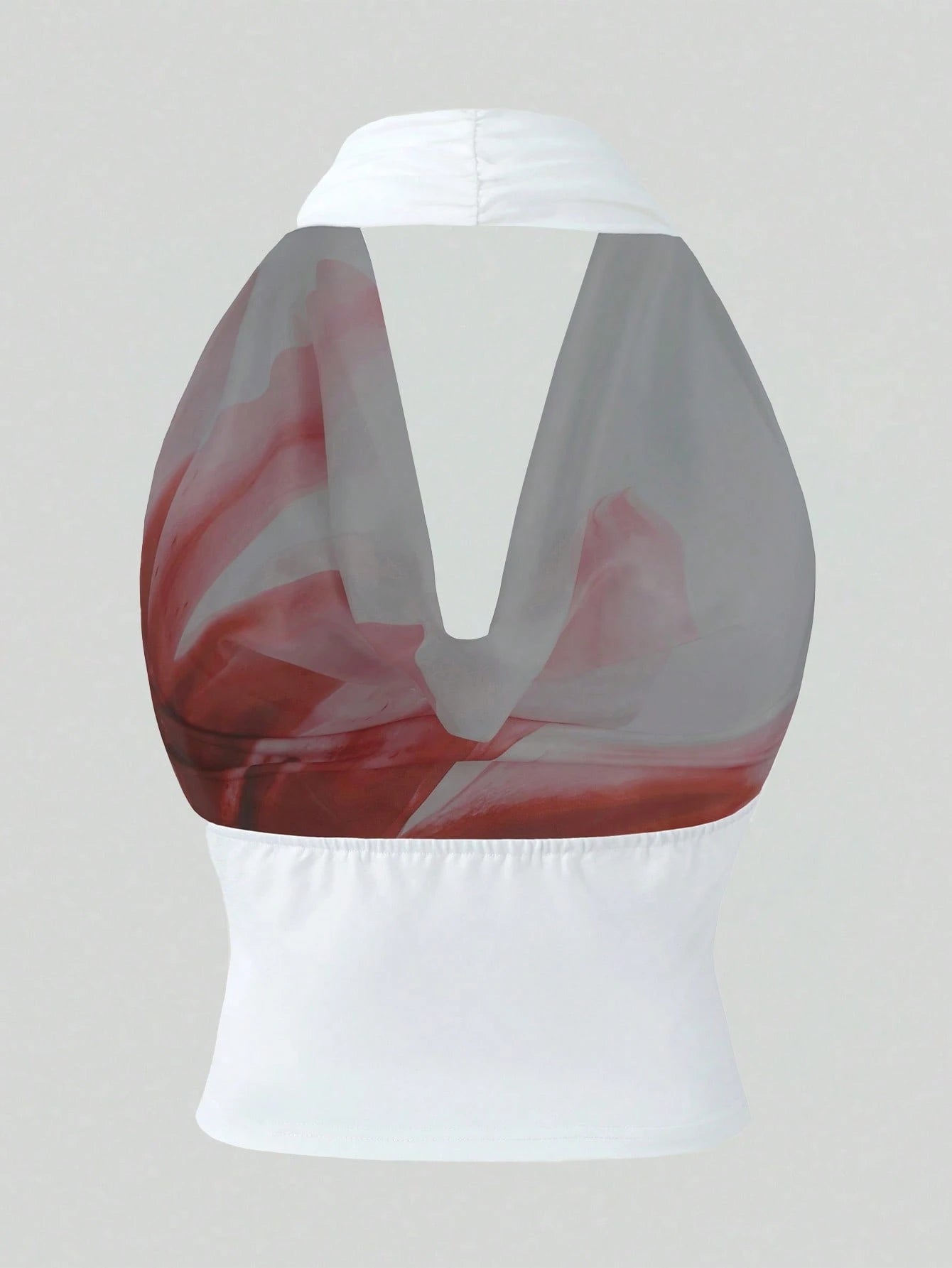 White top with red and gray abstract design on a light gray background