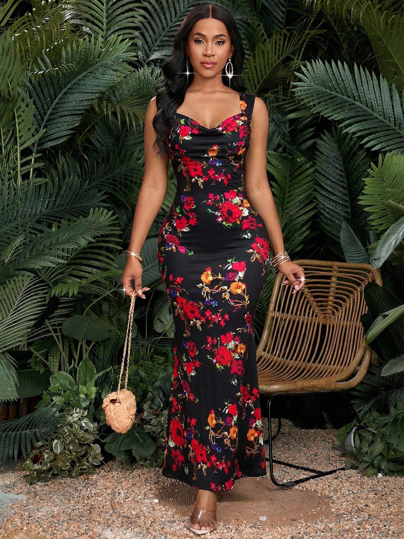 Woman in a floral dress standing in front of green foliage