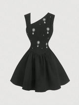 Black dress with decorative elements on a white background