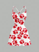 White dress with red floral pattern on a gray background
