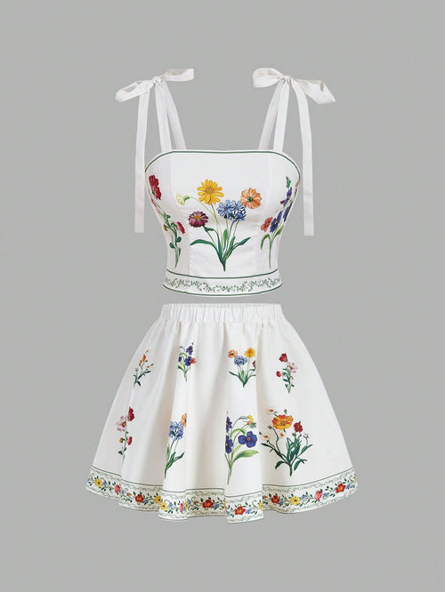 White two-piece outfit with floral embroidery on a gray background
