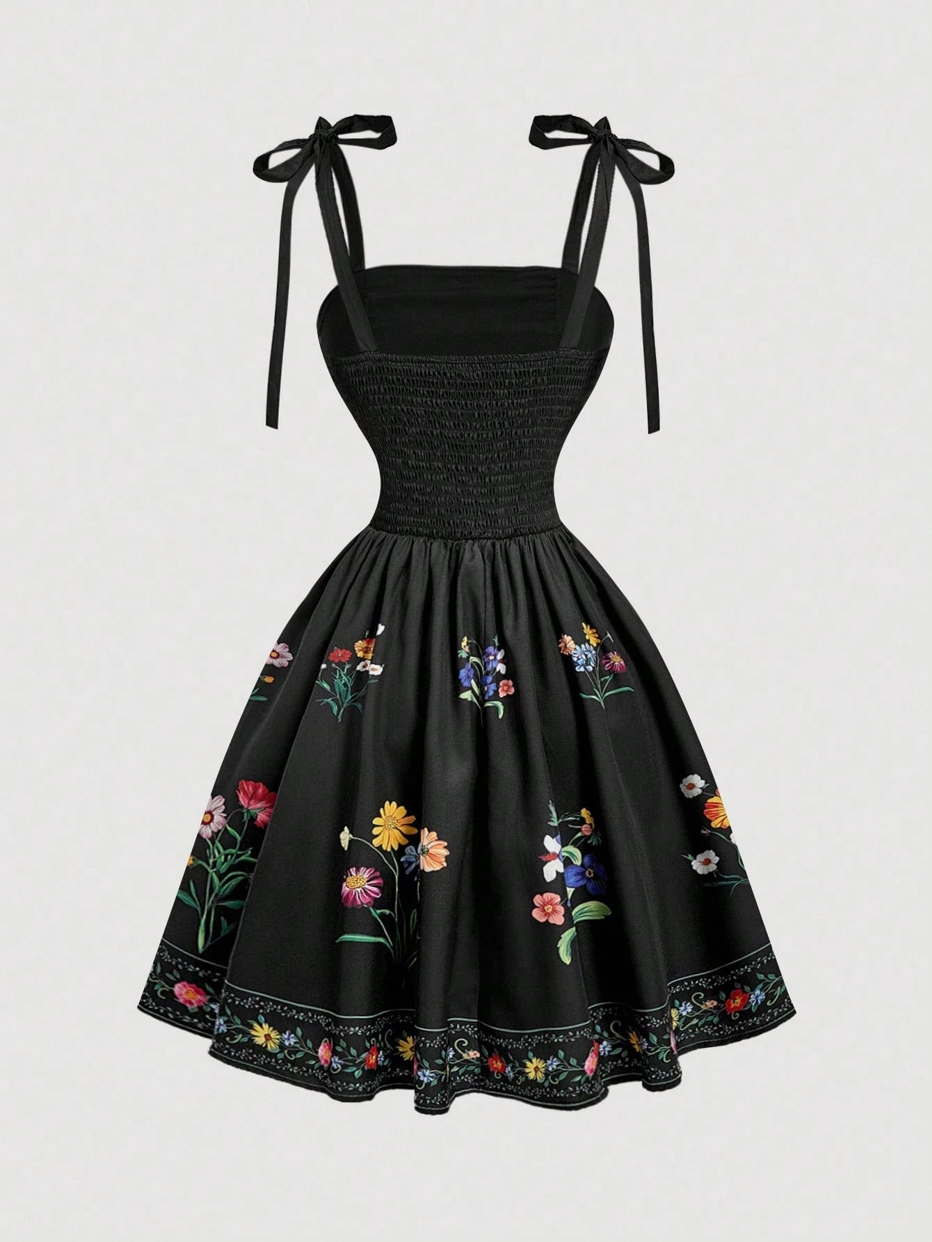 Black dress with floral embroidery on a white background