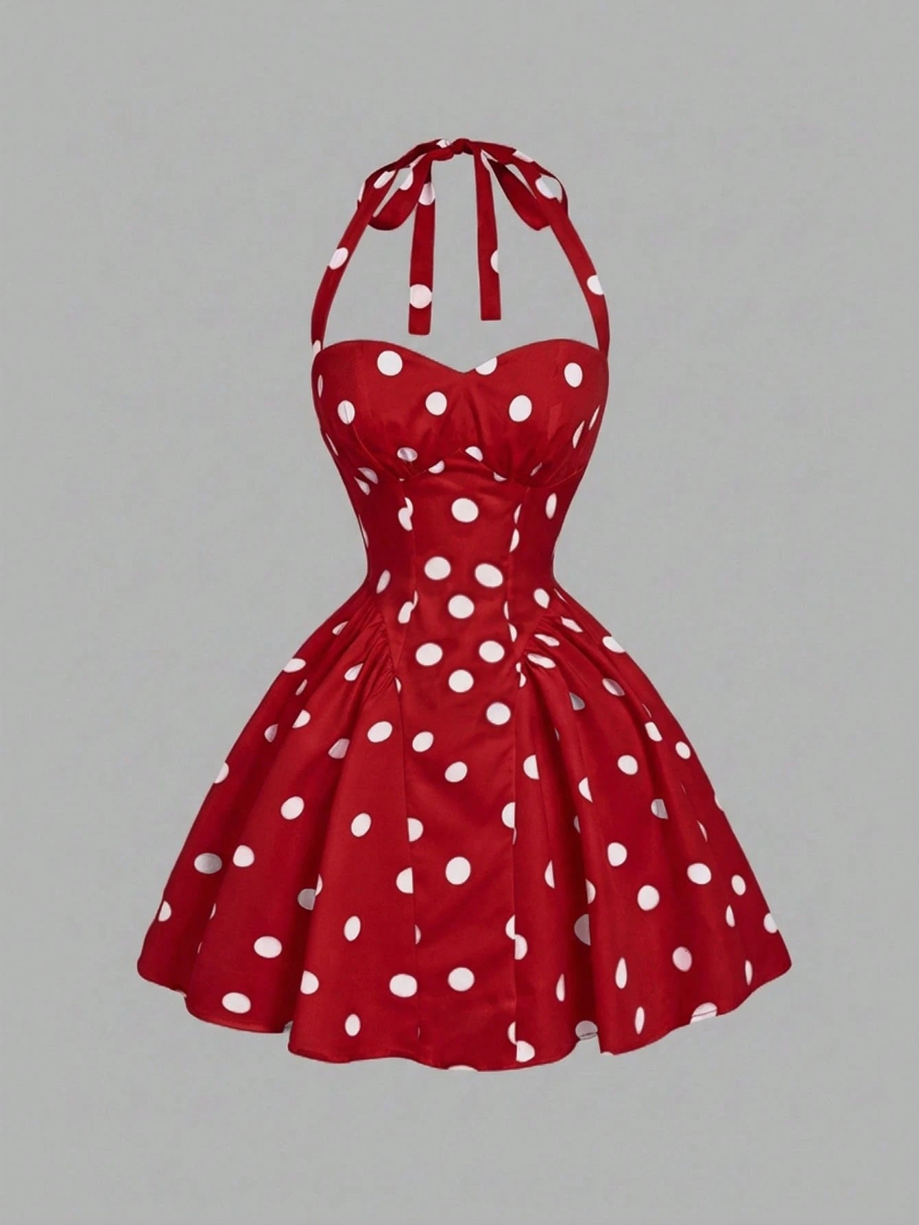 Red polka dot dress on a gray background
