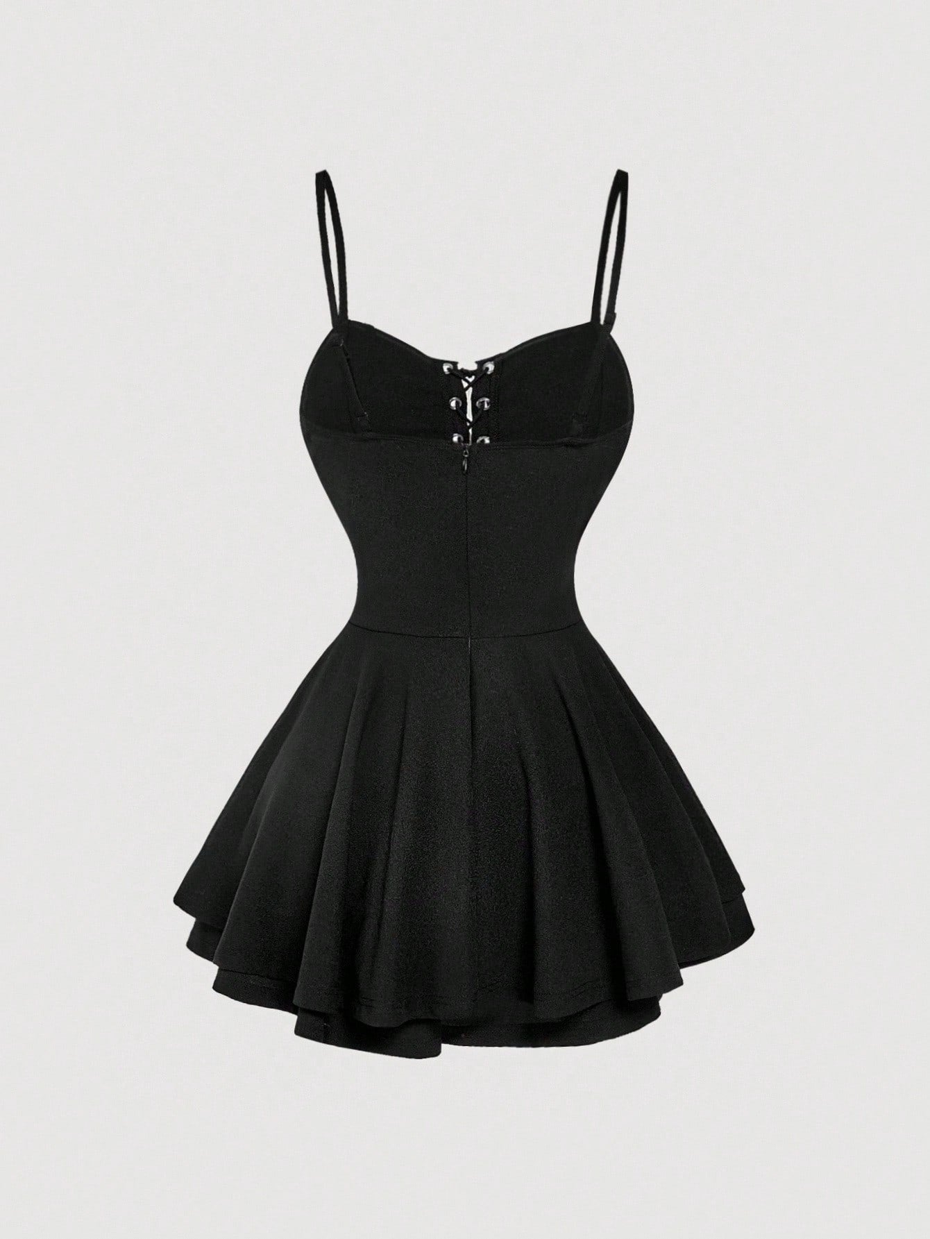 Black dress with thin straps on a light gray background