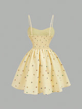 Yellow dress with floral pattern on a gray background