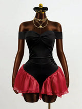 Mannequin wearing a black off-shoulder top with a red skirt on a white background