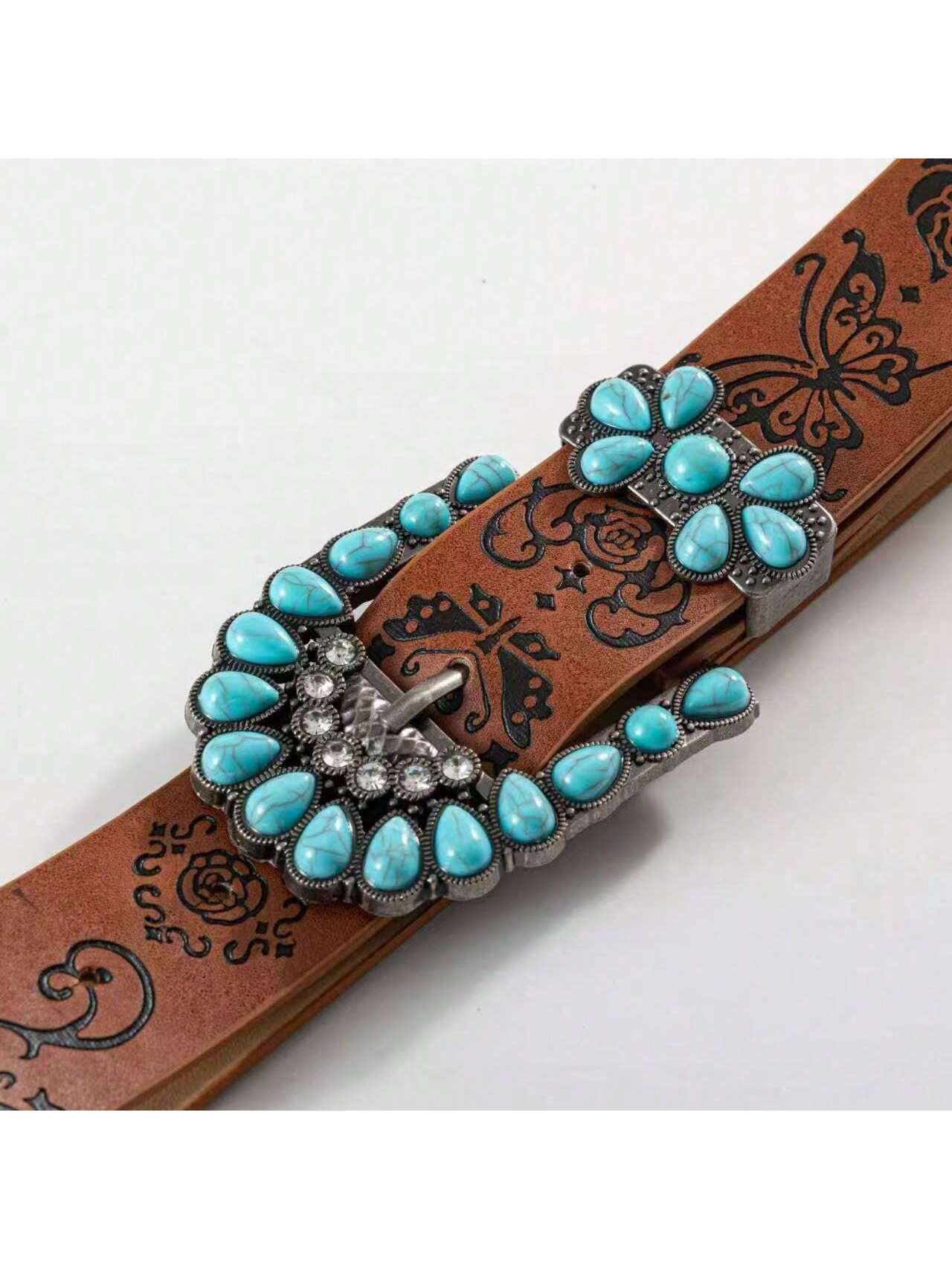 Belt with turquoise stone buckle on a white background