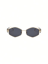 Hexagonal sunglasses with gold frame and dark lenses on a white background