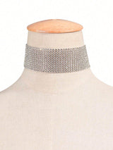 Silver choker necklace on a mannequin with a white background