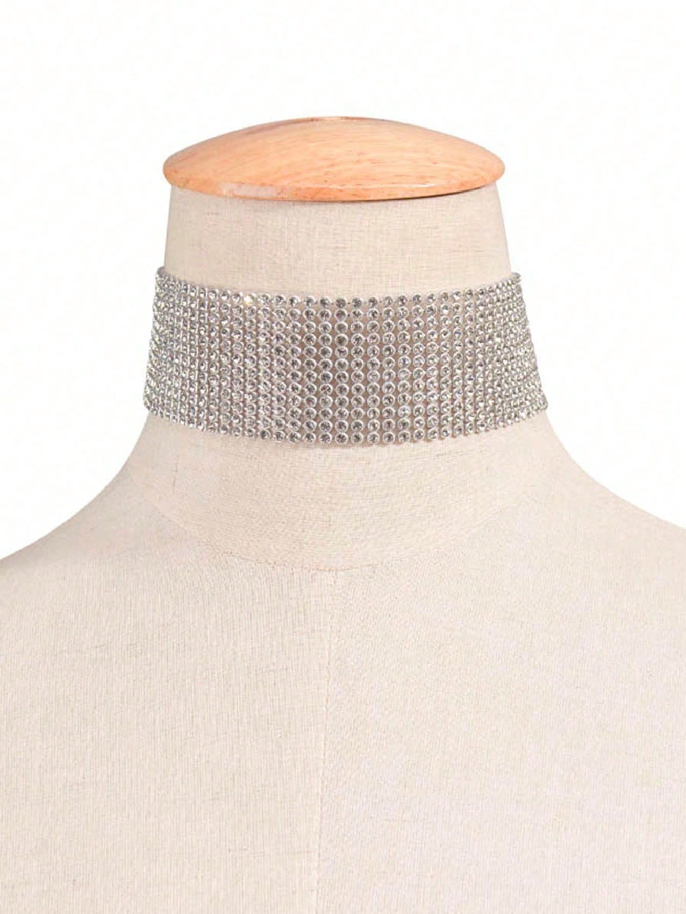 Silver choker necklace on a mannequin with a white background