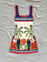 Colorful dress with tropical patterns on a white background