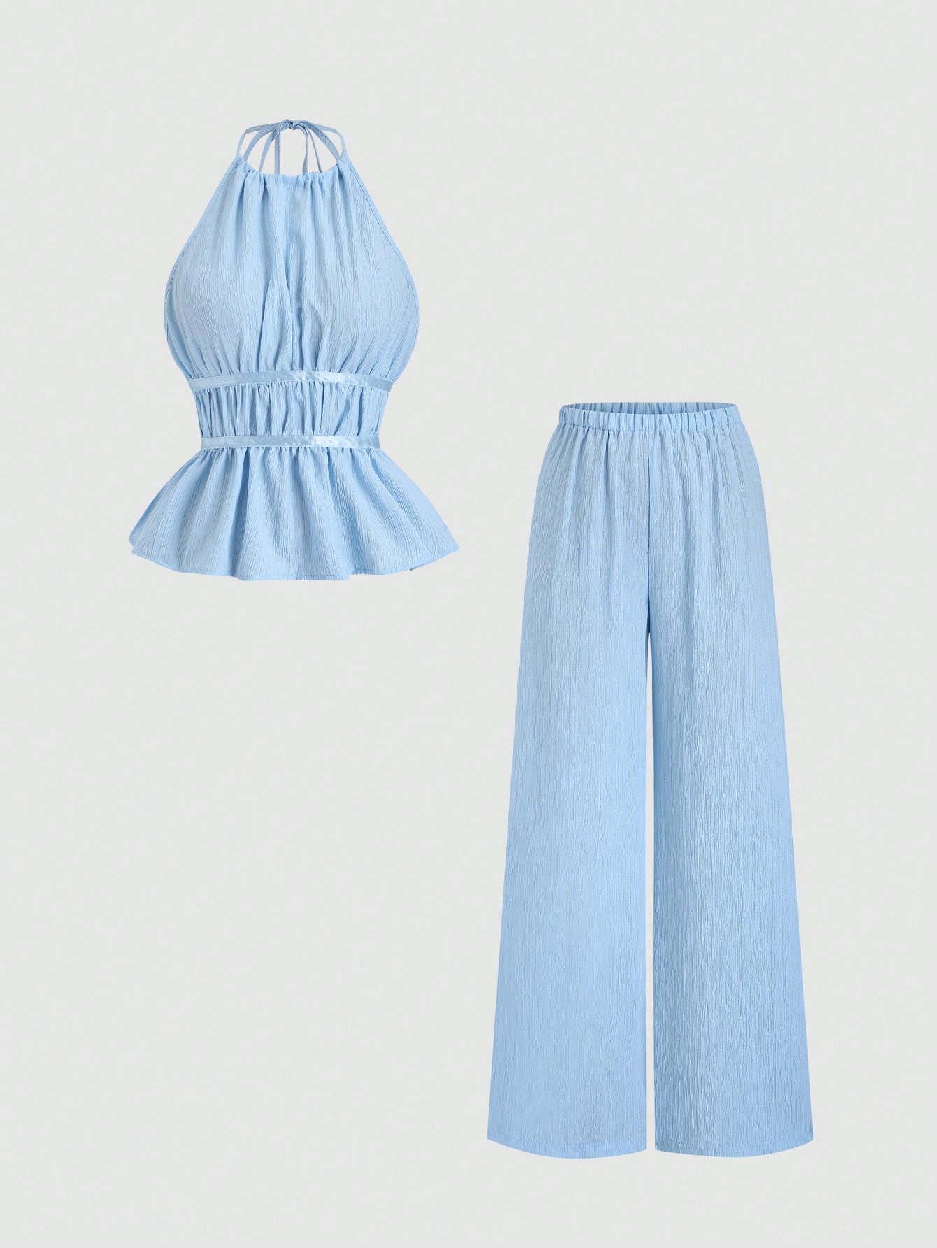Light blue jumpsuit with halter top and wide-leg pants on a light gray background