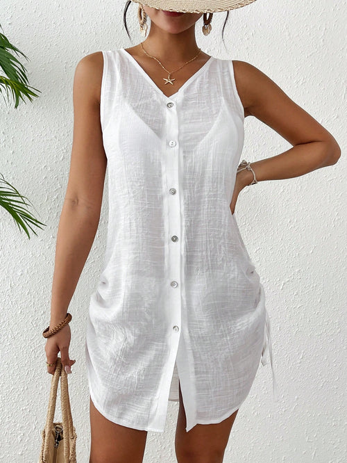 Woman wearing a white sleeveless button-up shirt against a white background