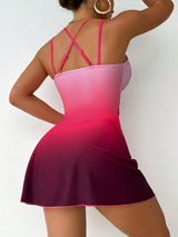 Woman wearing a pink and purple ombre dress with thin straps on a white background