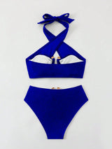 Blue bikini set with a white interior on a light gray background