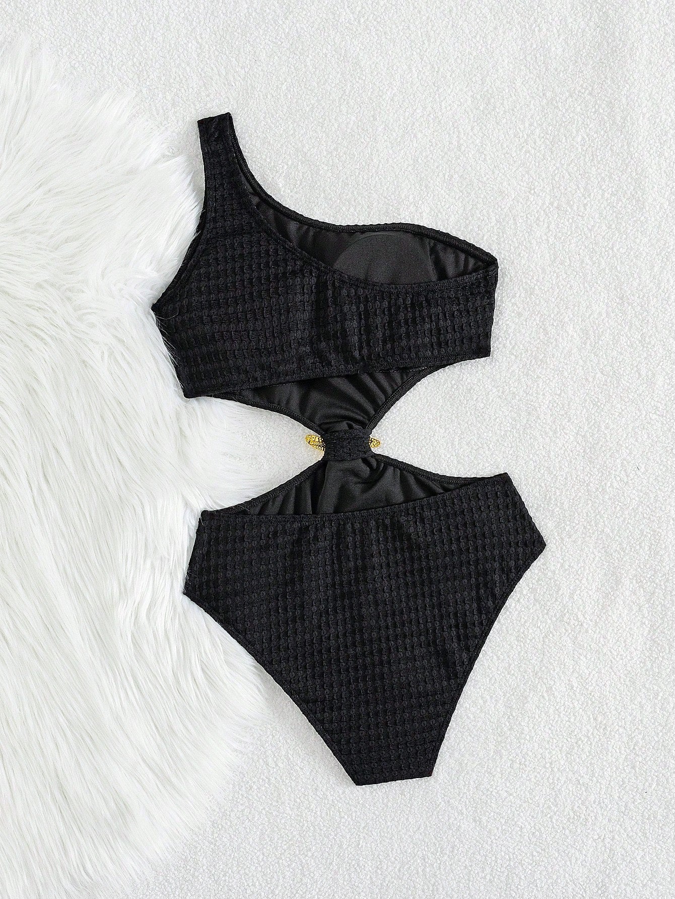 Black checkered bikini set on a white background