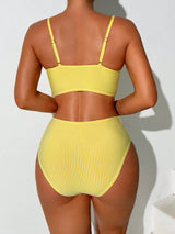 Yellow bikini set on a white background