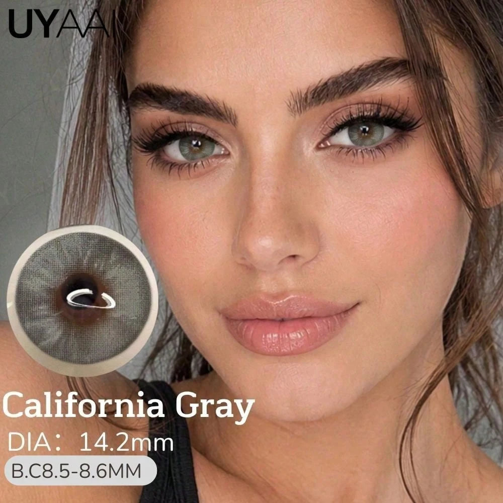 Close-up of a woman wearing gray contact lenses, with a circular inset showing the lens design and text reading 'California Gray', 'DIA: 14.2mm', and 'B.