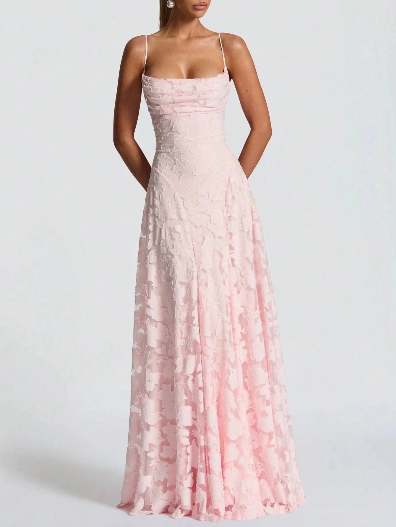 Pink lace dress on a white background