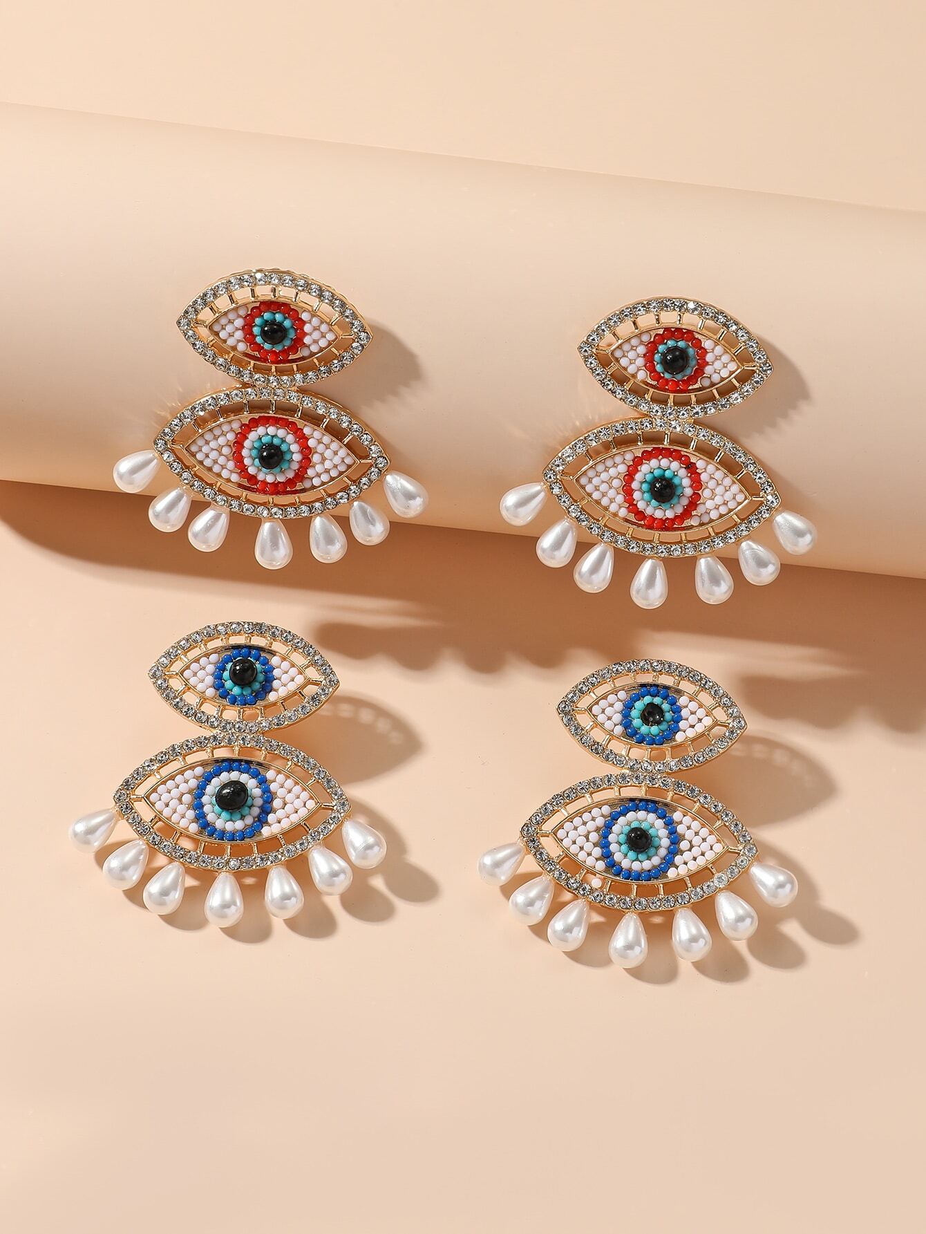 SHEIN 1pair Exaggerated Fashionable Eye-Shaped Imitation Faux Pearl Earrings